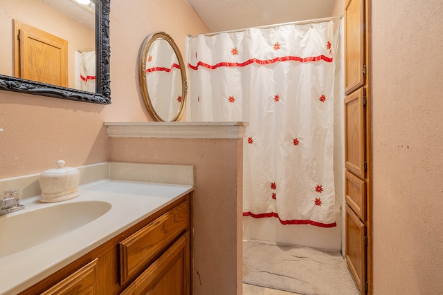 bathroom featuring vanity and shower / tub combo with curtain