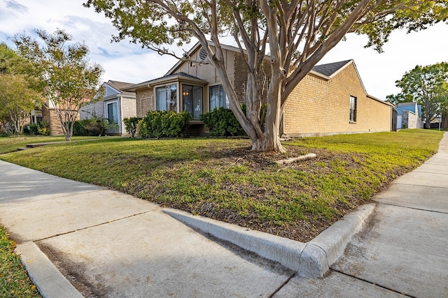 view of front of home with a front lawn