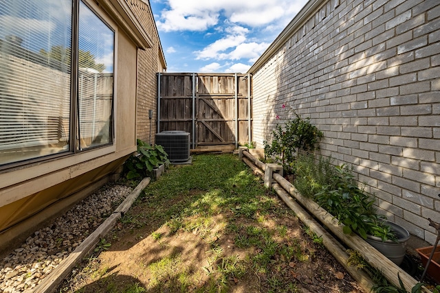 view of yard with central AC