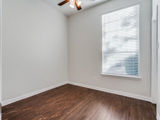 spare room featuring dark hardwood / wood-style floors and ceiling fan