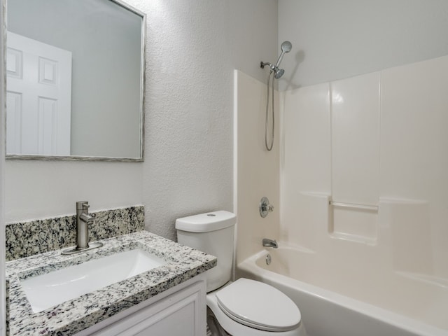 full bathroom with vanity, tub / shower combination, and toilet