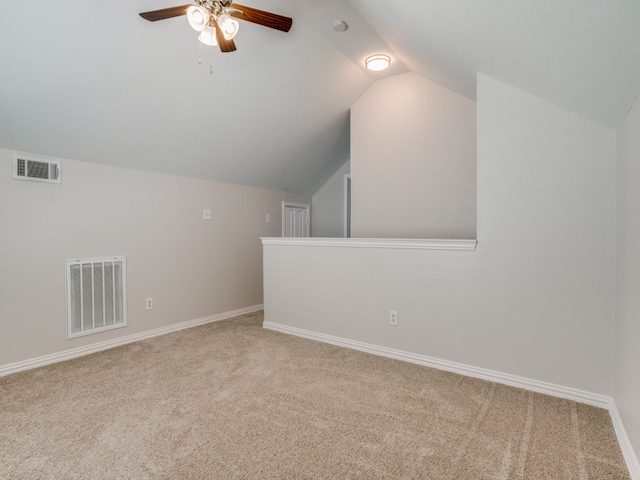 additional living space featuring carpet flooring, ceiling fan, and lofted ceiling