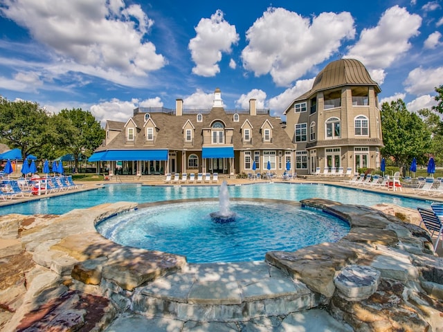 view of pool featuring pool water feature