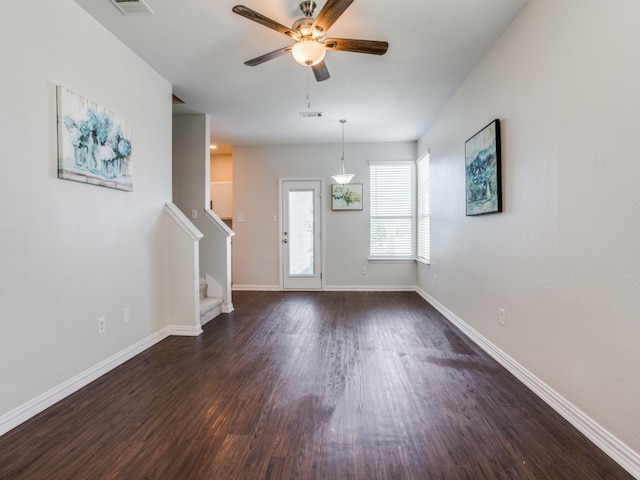 foyer with ceiling fan and dark wood-type flooring