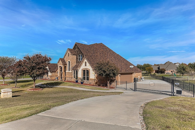 view of front of house featuring a front yard and a garage