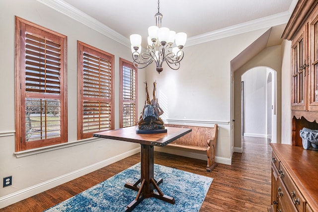 dining room featuring crown molding, an inviting chandelier, and dark hardwood / wood-style flooring