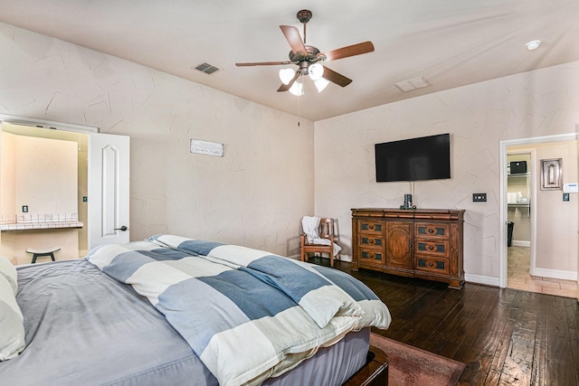 bedroom with dark hardwood / wood-style floors and ceiling fan