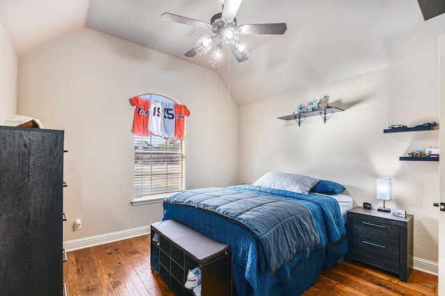 bedroom featuring lofted ceiling, dark wood-type flooring, and ceiling fan