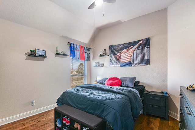 bedroom featuring dark wood-type flooring, ceiling fan, and lofted ceiling