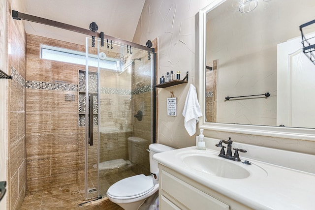 bathroom featuring vanity, an enclosed shower, and toilet