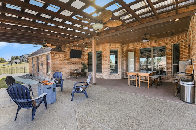 view of patio featuring ceiling fan and a pergola