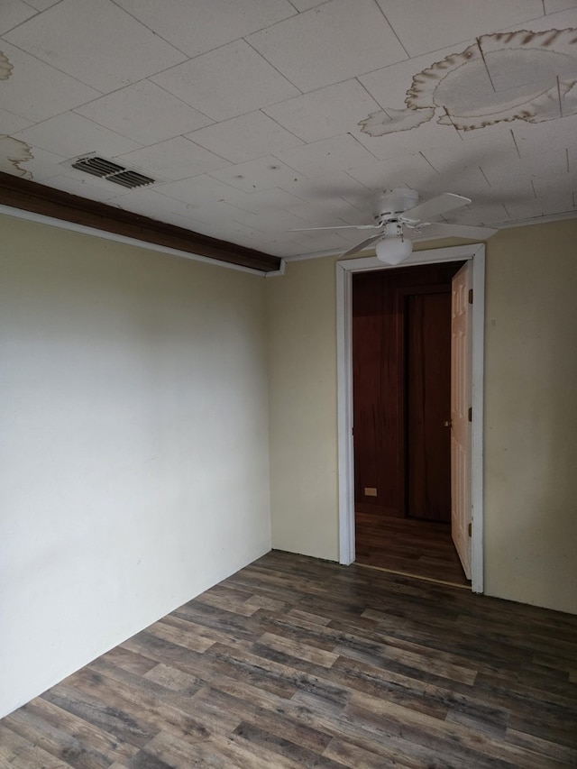 708 Walnut St, Atlanta, TX 75551 - unfurnished room featuring dark wood-type flooring and ceiling fan