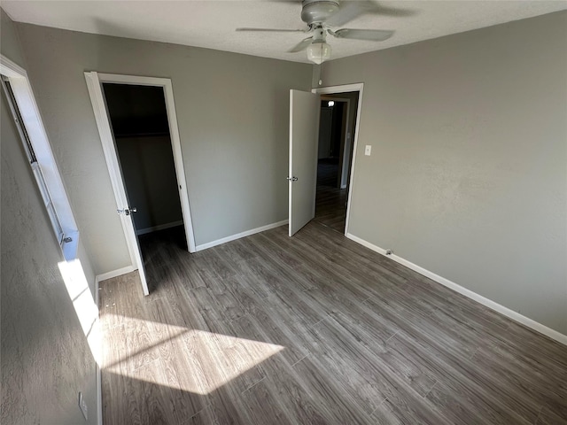 424 E Ragley St, Henderson, TX 75654 - unfurnished bedroom featuring wood finished floors, baseboards, and ceiling fan