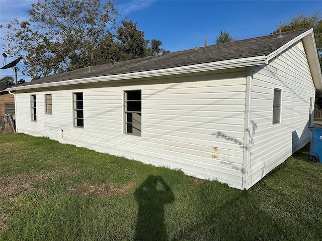 view of property exterior with a yard