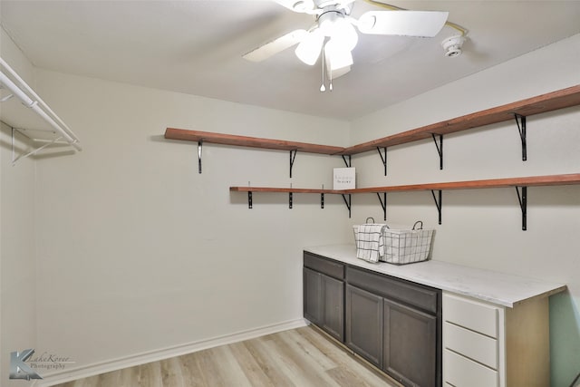 interior space with light wood-type flooring and ceiling fan