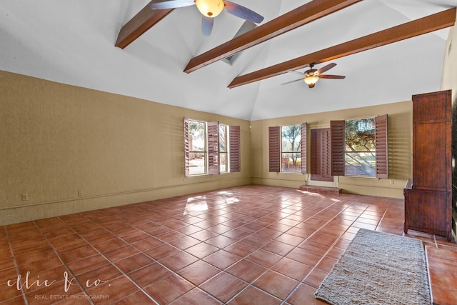 unfurnished living room featuring ceiling fan, high vaulted ceiling, tile patterned floors, and beamed ceiling