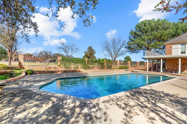 view of swimming pool with a patio