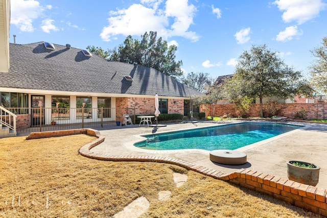 view of swimming pool with a patio