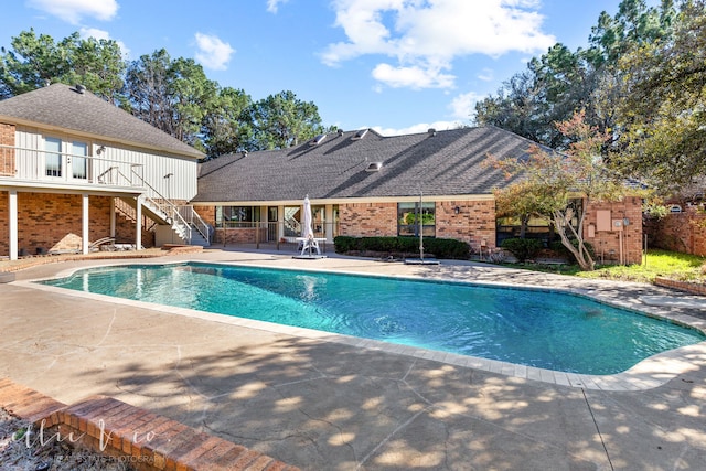 view of swimming pool with a patio