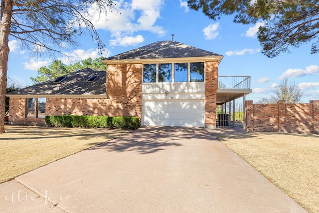 view of front of property with a garage and a balcony