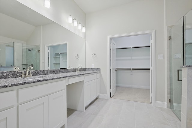 bathroom featuring vanity, tile patterned floors, an enclosed shower, and lofted ceiling