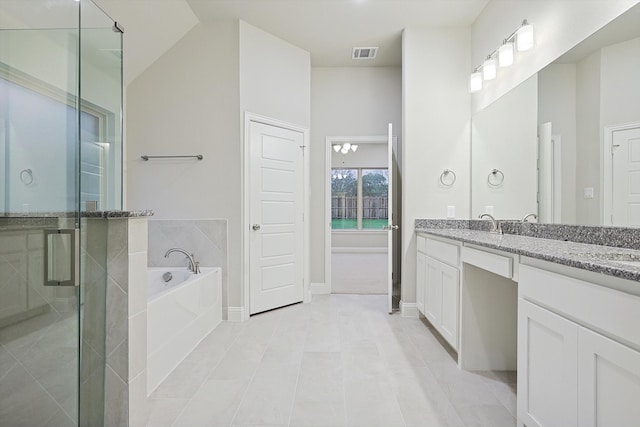 bathroom featuring tile patterned flooring, a chandelier, vaulted ceiling, shower with separate bathtub, and vanity