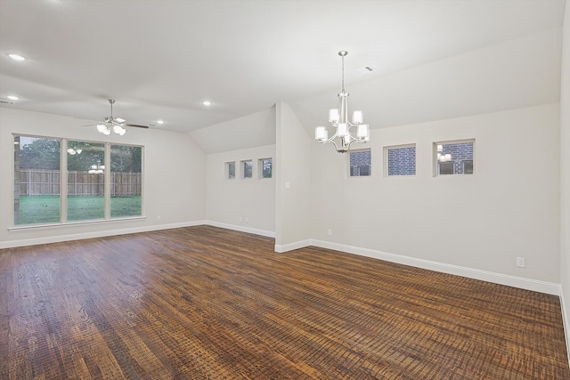 unfurnished room featuring ceiling fan with notable chandelier and vaulted ceiling