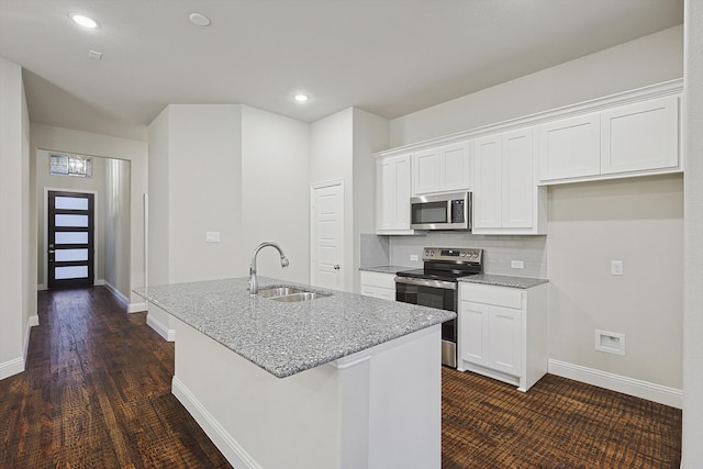 kitchen with a kitchen island with sink, sink, white cabinets, and stainless steel appliances