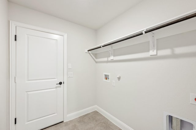 washroom featuring hookup for an electric dryer, hookup for a washing machine, light tile patterned floors, and gas dryer hookup