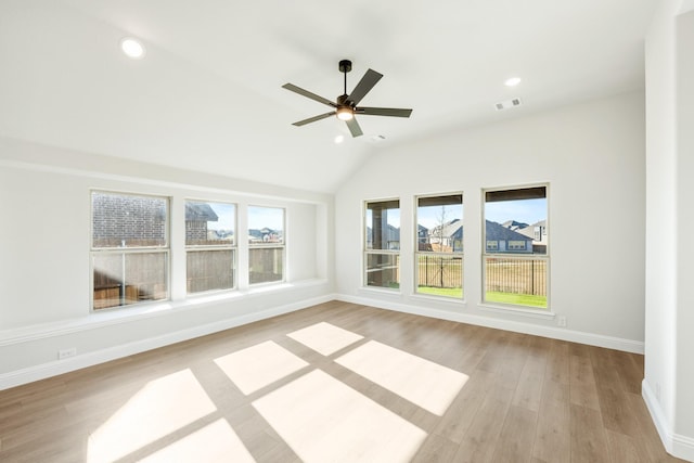 unfurnished sunroom with ceiling fan and lofted ceiling