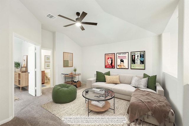 carpeted living room with ceiling fan and vaulted ceiling