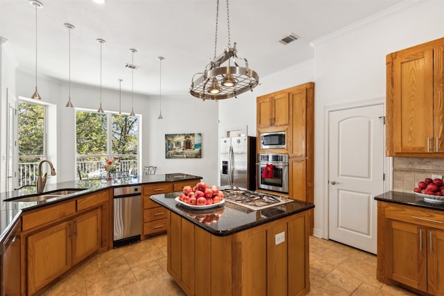 kitchen with sink, a center island, tasteful backsplash, appliances with stainless steel finishes, and ornamental molding