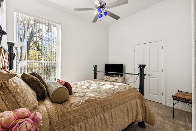 bedroom featuring carpet floors, ceiling fan, and crown molding