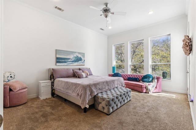 bedroom with ceiling fan, carpet floors, and crown molding