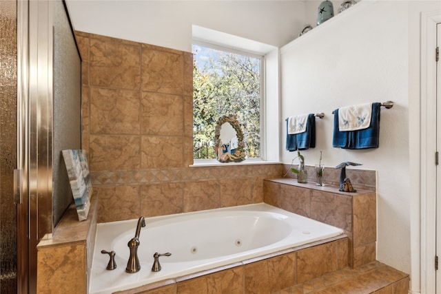 bathroom featuring tiled bath