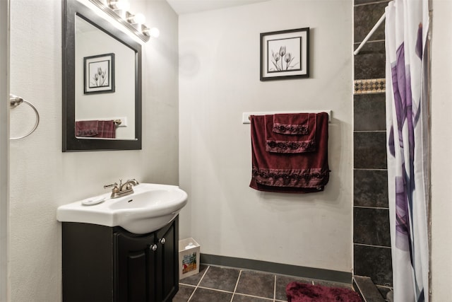 bathroom featuring a shower with shower curtain, vanity, and tile patterned floors