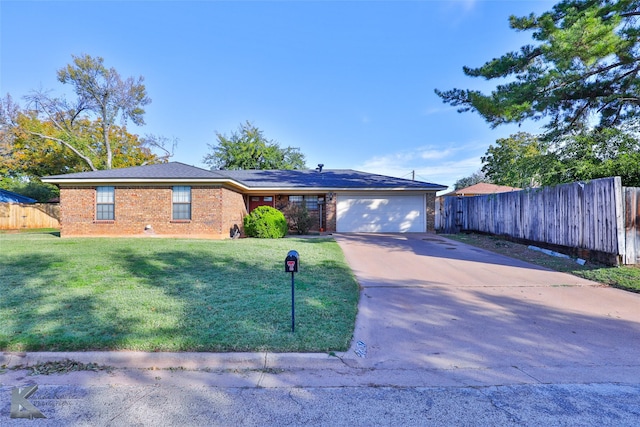 ranch-style house with a garage and a front yard