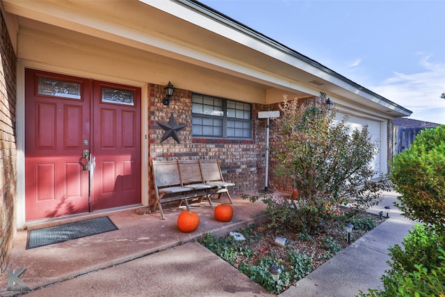 view of exterior entry featuring a porch