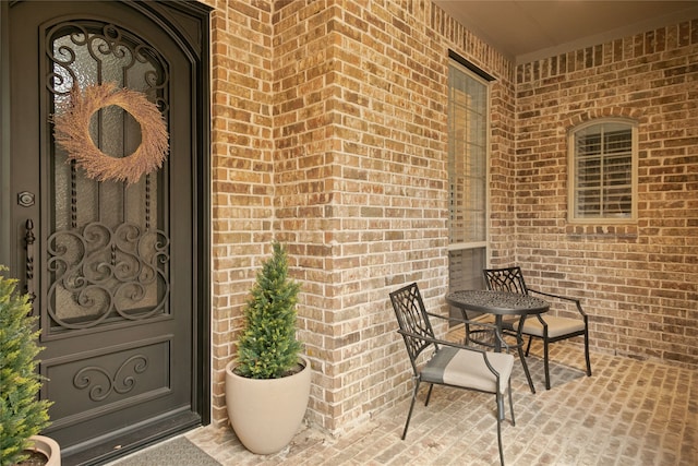 view of exterior entry with a porch