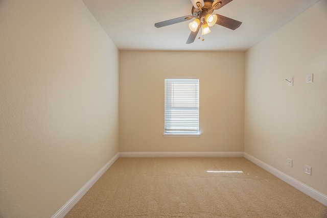 empty room featuring carpet and ceiling fan