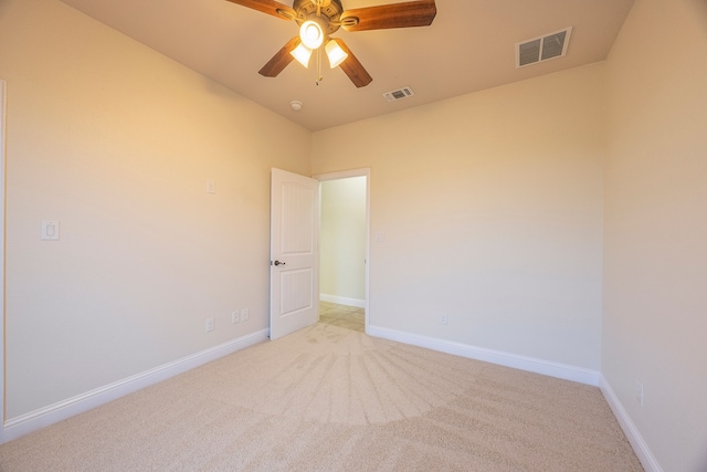 unfurnished room featuring ceiling fan and light colored carpet