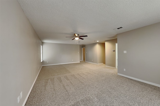 701 Squire Ct, Allen, TX 75002 - spare room featuring ceiling fan, a textured ceiling, light colored carpet, and baseboards