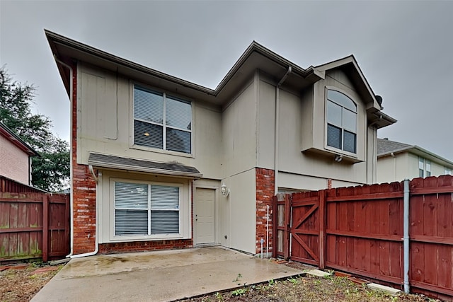 701 Squire Ct, Allen, TX 75002 - view of front facade with a patio area and brick siding