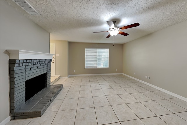 701 Squire Ct, Allen, TX 75002 - unfurnished living room with ceiling fan, a textured ceiling, a fireplace, light tile patterned floors, and baseboards