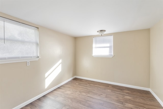 empty room with light hardwood / wood-style floors