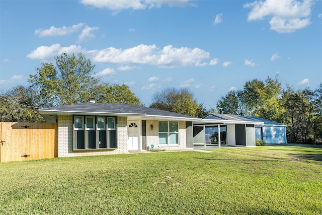 ranch-style house with a front lawn