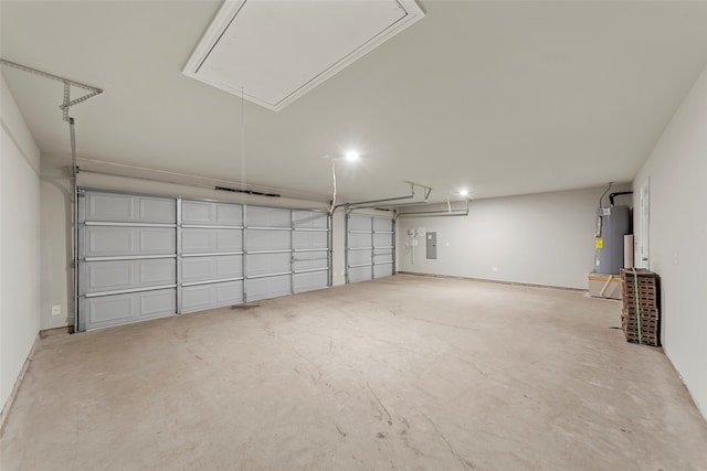 garage featuring water heater and electric panel