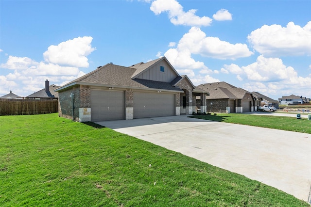 view of front facade with a garage and a front lawn