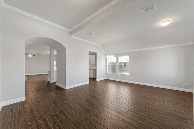 spare room featuring dark hardwood / wood-style flooring, ornamental molding, and ceiling fan