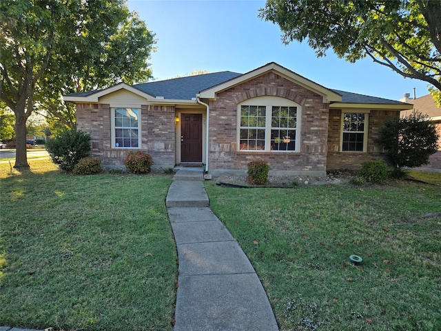 ranch-style house with a front lawn